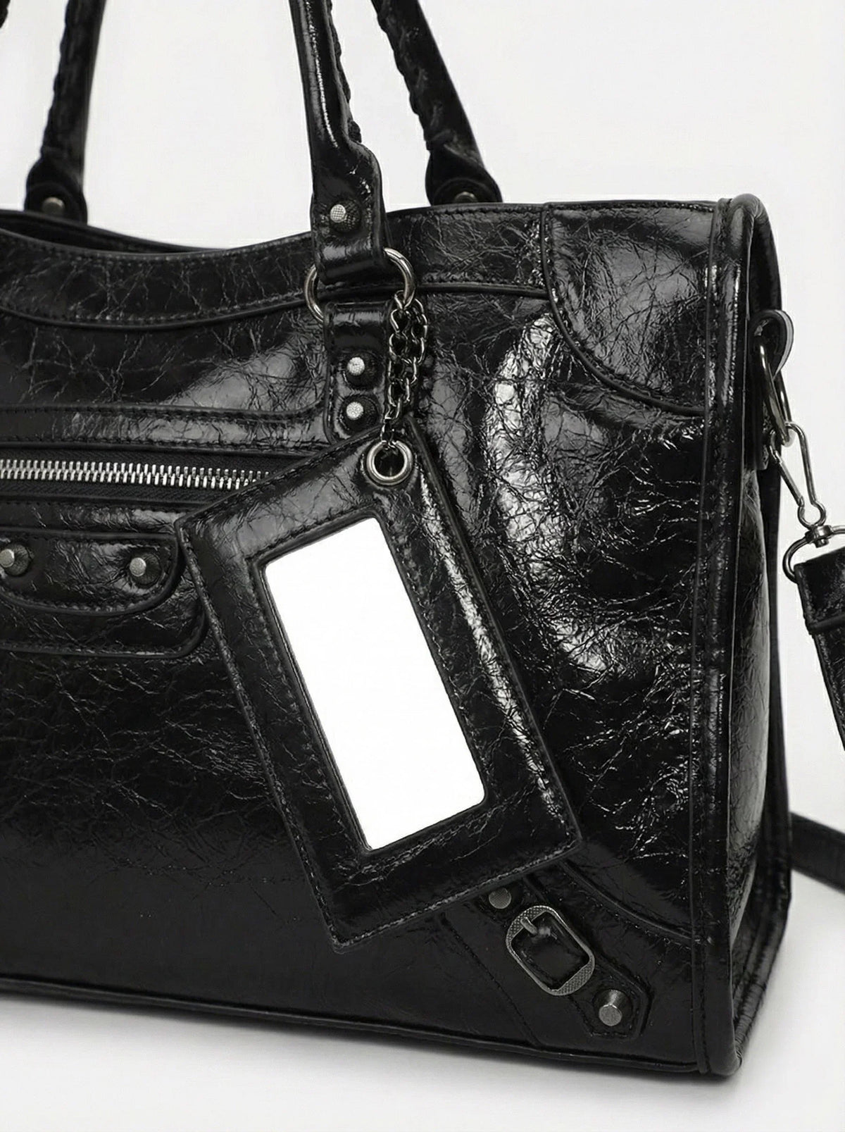 Carmela handbag interior showing spacious main compartment and pockets