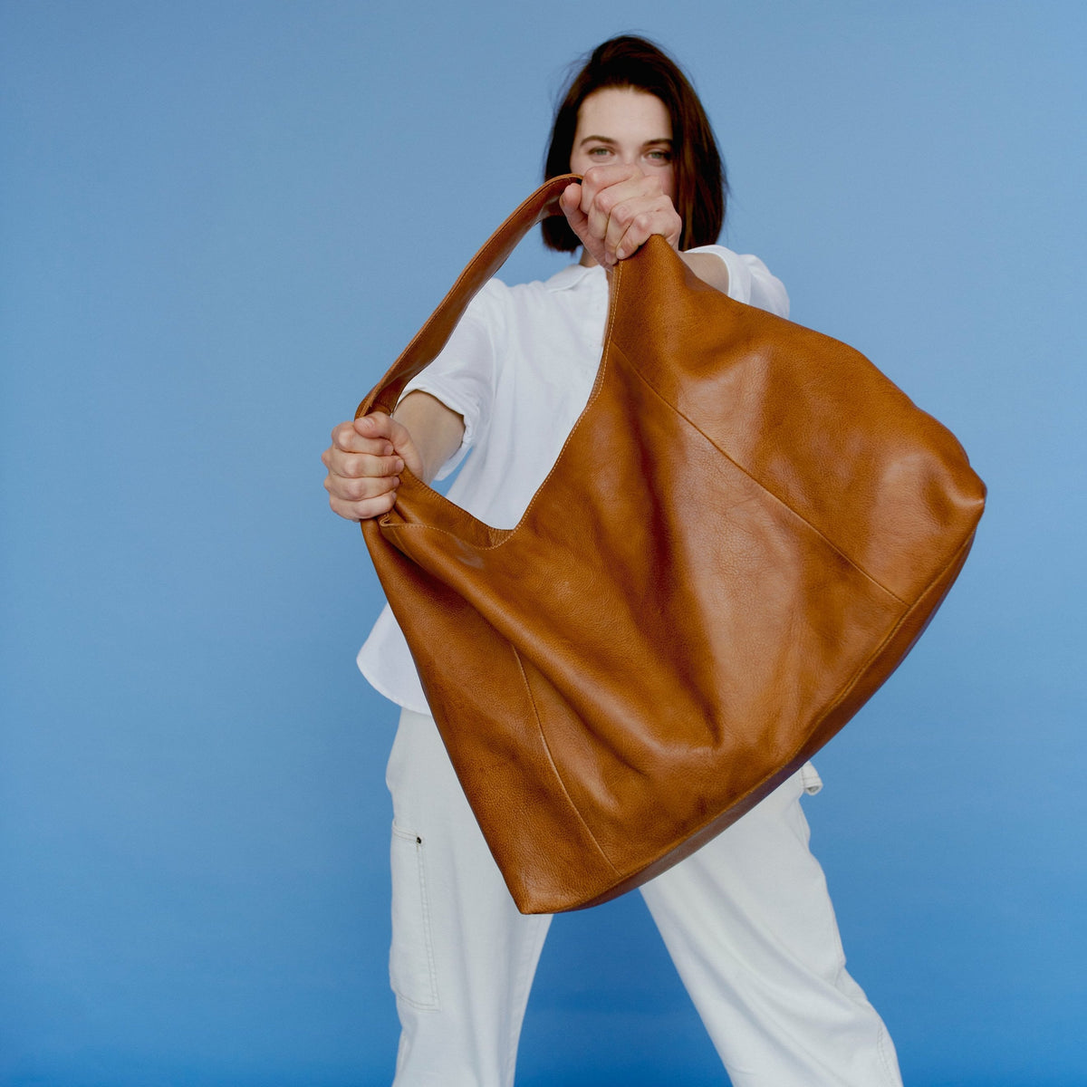 Model wearing the Lindsey Tote, showing its oversized silhouette
